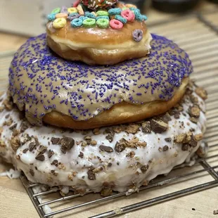 a stack of donuts with sprinkles