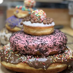 a stack of doughnuts with sprinkles