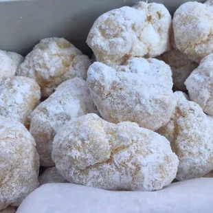 a box of powdered sugar donuts