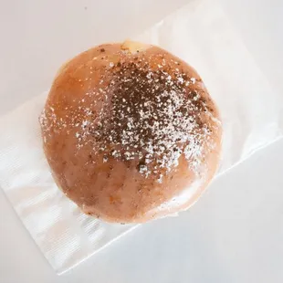 a donut covered in powdered sugar