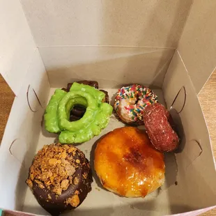 Butterfingers cronut, creme Brule, red velvet, Blueberry sprinkle, matcha glazed old fashioned, and chocolate old fashioned