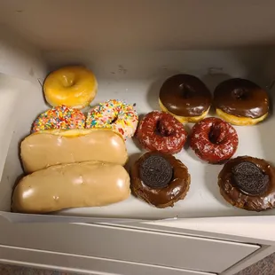 Maple bars, sprinkle, glazed, chocolate, red velvet, and oreo chocolate donuts.