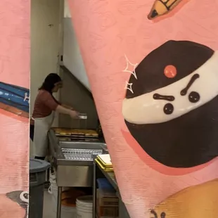 Frying up the donuts!