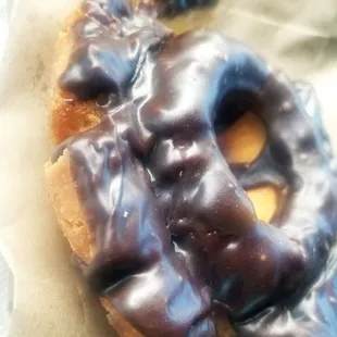 a chocolate frosted donut