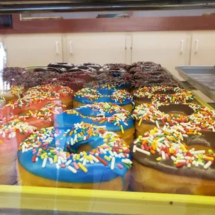 a variety of donuts with sprinkles