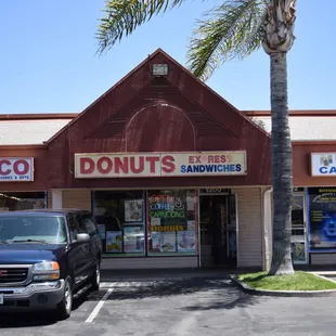 a car parked in front of a donut shop