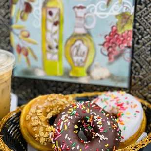 a basket of doughnuts and a drink