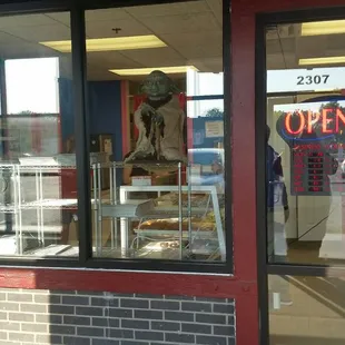 a donut shop with a sign in the window