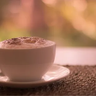 a cup of coffee on a saucer