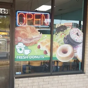 open sign in window of restaurant