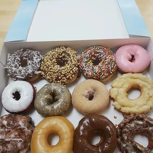 a variety of doughnuts in a box