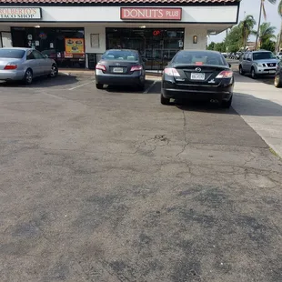 two cars parked in a parking lot