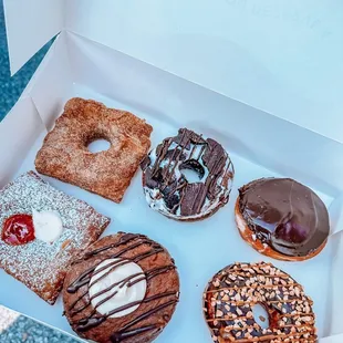a variety of donuts in a box