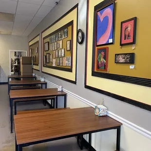 a row of tables and benches