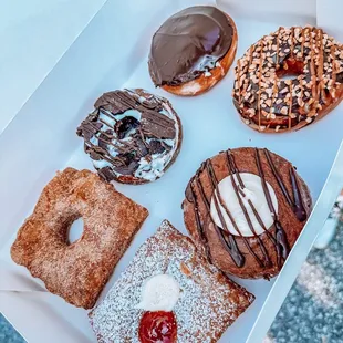 a variety of donuts in a box