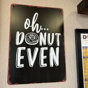a donut even sign on a wall
