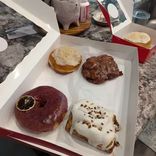 Organic lemon blueberry, bourbon pecan cinnamon roll, strawberry fritter, banana pudding and cherry pie