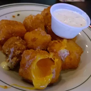 Cheese Curds - Tasty but more like fried cheese.  Get 1/2 pepper jack 1/2 chedder