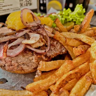 a burger and french fries on a table