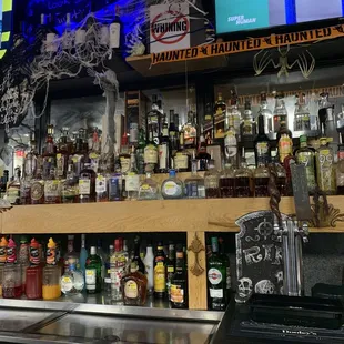 a bar filled with liquor bottles
