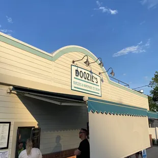 people standing outside of a store