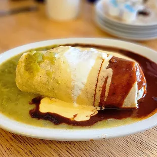 Doozy Burrito smothered and covered with red and green chiles and queso.