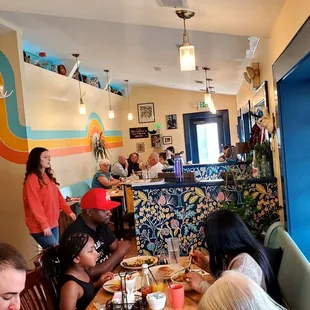 a group of people eating at a restaurant