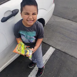 Handsome boy with a nice haircut and hot chips