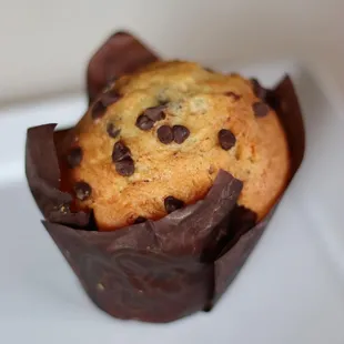 a chocolate chip muffin on a plate