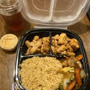 Hibachi chicken with fried rice and sautéed vegetables