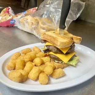Double cheese burger on texas toast and tots