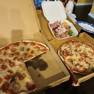 Pepperoni pizza(far left), Chicken pizza(right) and Antipasto salad(back).
