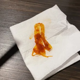 a piece of pizza on a napkin