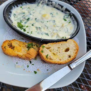 a bowl of soup and bread