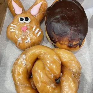 three doughnuts in a box