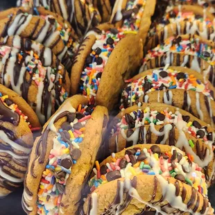 a tray of cookies with chocolate and sprinkles