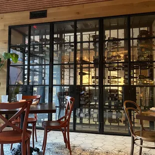 a dining area with tables and chairs