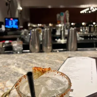 a margarita in a glass on a bar