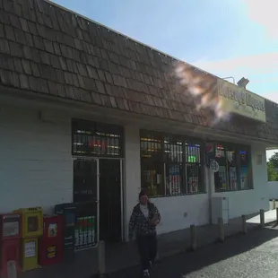 a woman standing in front of a store
