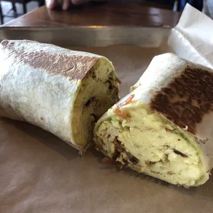 Boardwalk burrito : scrambled eggs, hash browns, bacon,  avocado, white cheddar