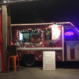 a food truck decorated for christmas