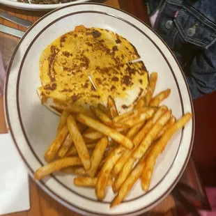 Kids quesadilla with seasoned fries, carne asada on back plate