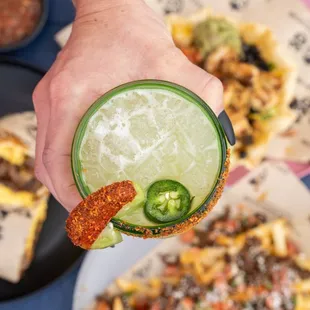 SPICY MARGARITA at Dos Amigos Mexican Cantina.  Jalapeno cucumber tequila,
Fresh jalapenos, lime juice, agave,
Tajin rim