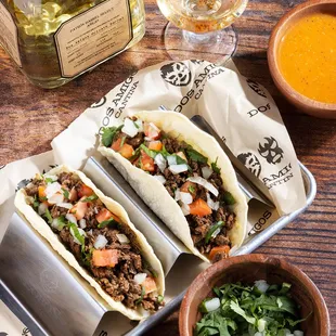 Dos Taco Plate served with your choice of pinto or black beans and
a side of pico de gallo