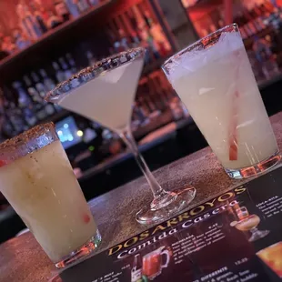 two cocktails on a bar