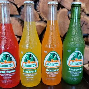 Pop open some color with our lineup of Jarritos! Which flavor are you grabbing first? #Jarritos #FlavorAdventure #DosBatosTacos