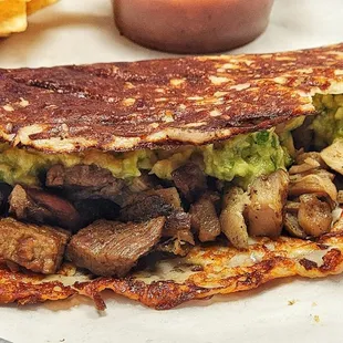 Go loco with our TACO LOCO! Enjoy a carb-conscious cheese tortilla filled with woodfired steak, juicy chicken, and fresh guac. #DosBatos