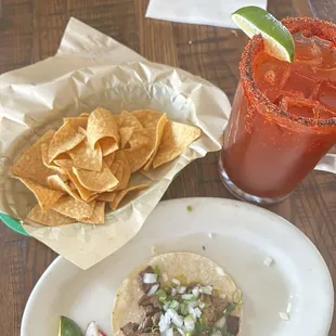 Steak tacos with a michelada