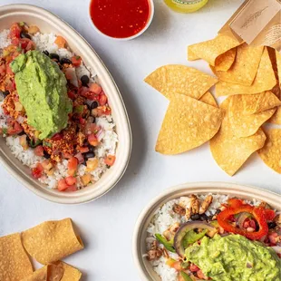 a variety of mexican food including rice, guacamole and tortillas