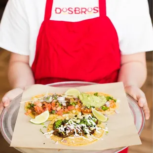 a person holding a plate of food